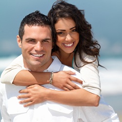 woman embracing the man from behind